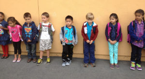 new kindergarten kids lining up first day of school